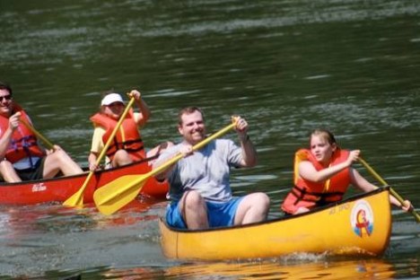 a group of people riding on the back of a boat