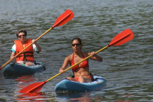 a man rowing a boat in the water