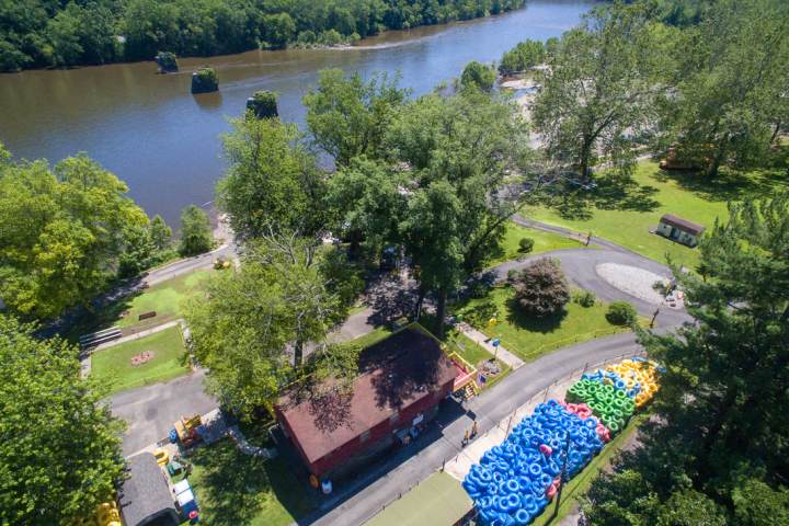 a garden with water in the background