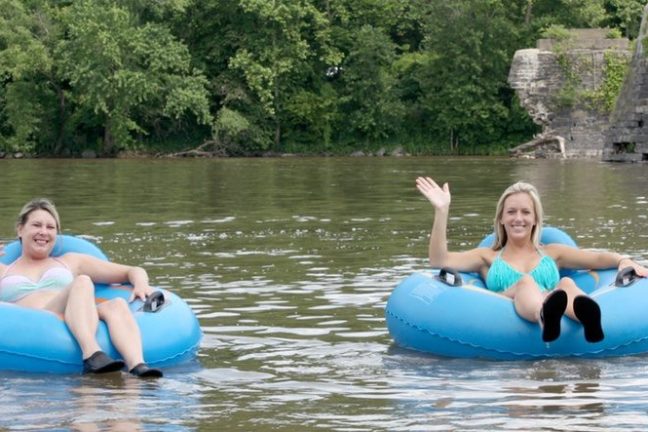 a group of people swimming in a body of water