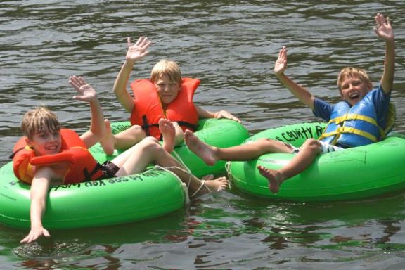 a group of people on a raft in a body of water