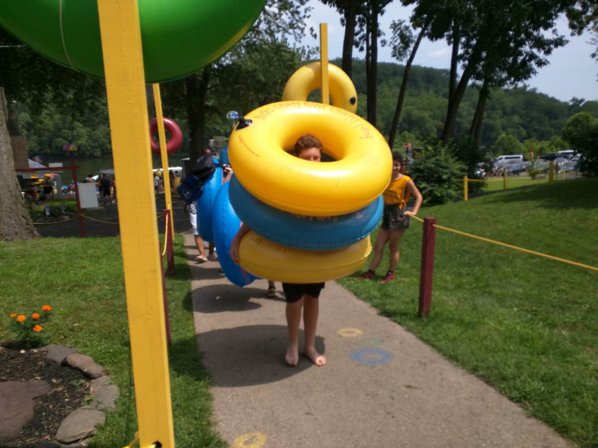 a person holding a frisbee in a yard