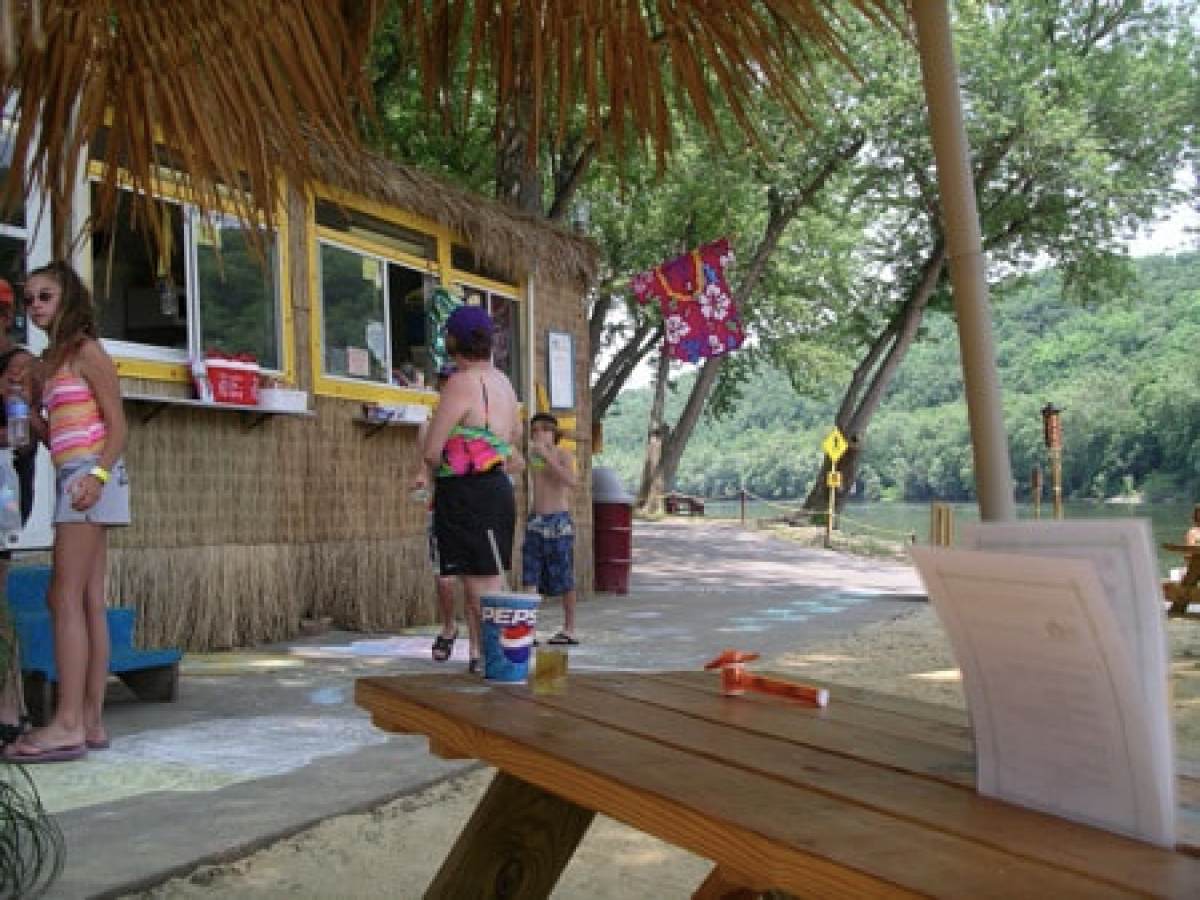 a group of people sitting at a bus stop