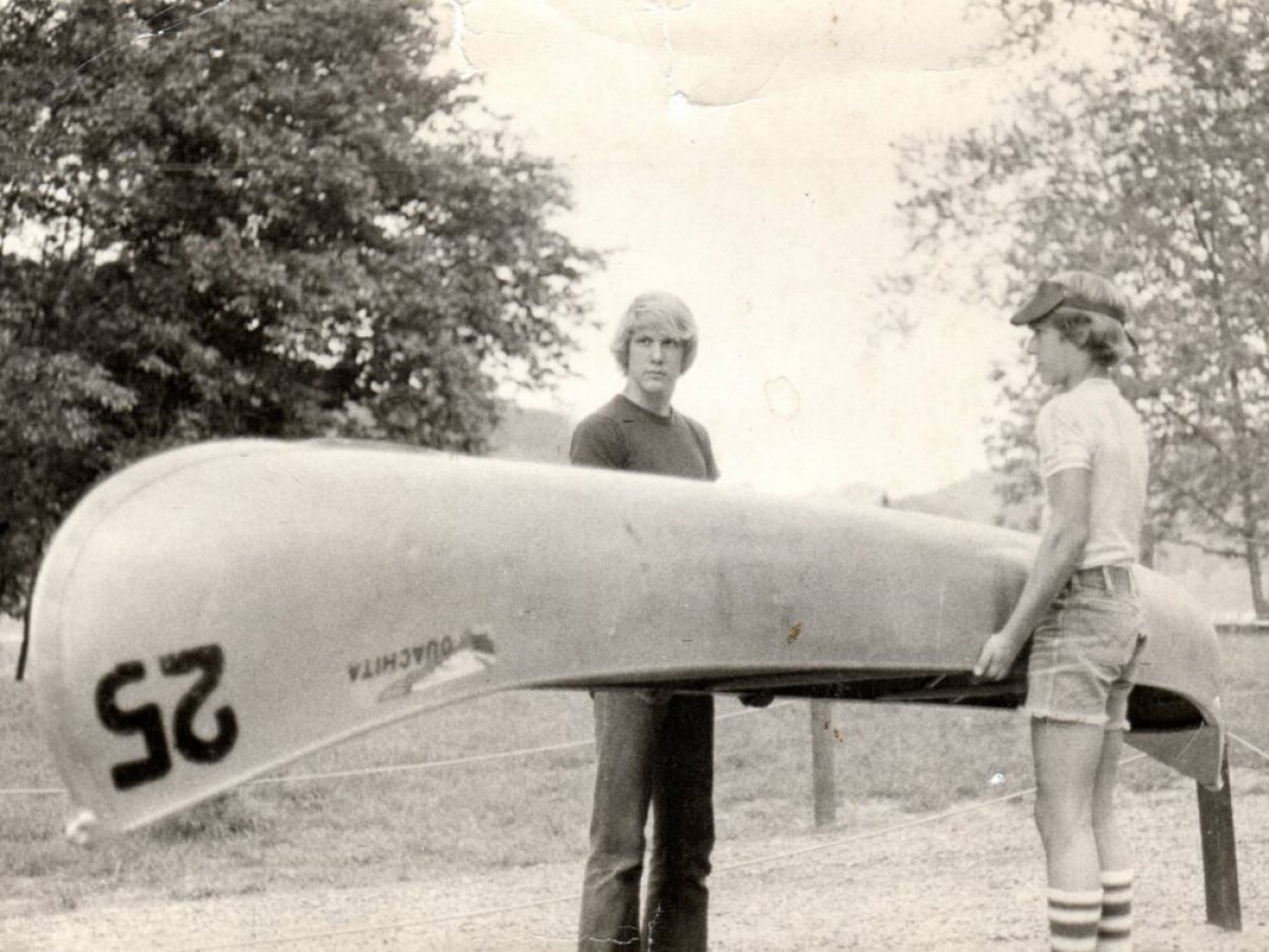 a man standing in front of a plane