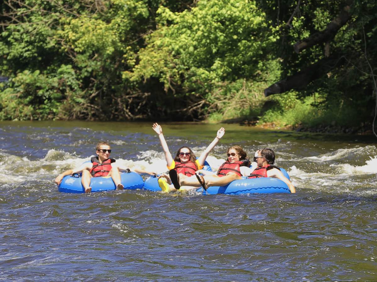 a group of people on a raft in a body of water