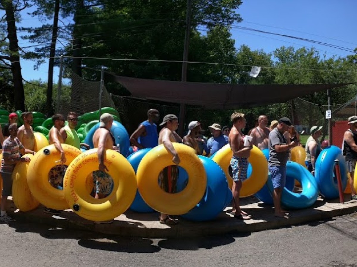 a group of people riding on the back of a motorcycle