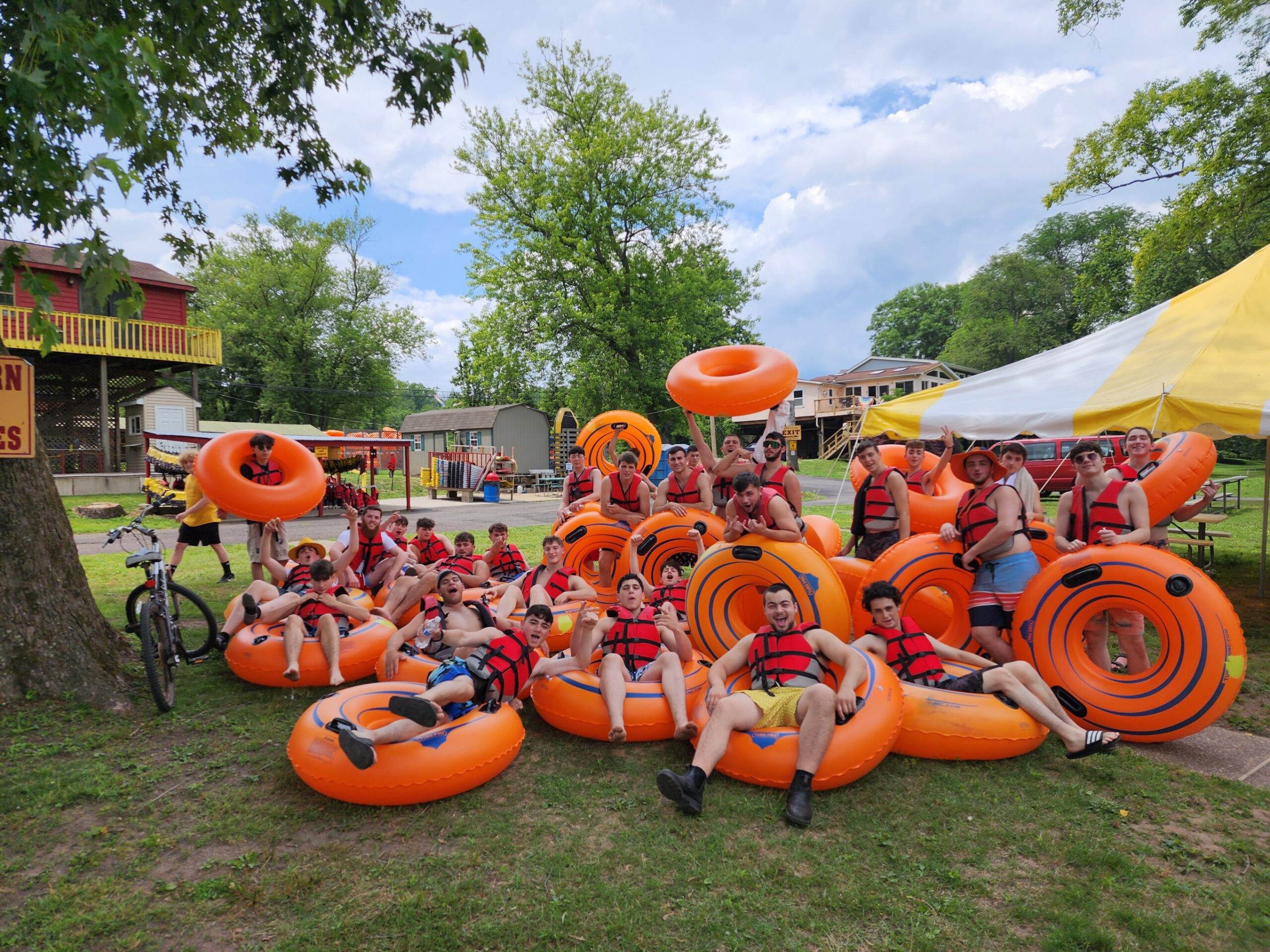 a group of lawn chairs sitting on top of a grass covered field