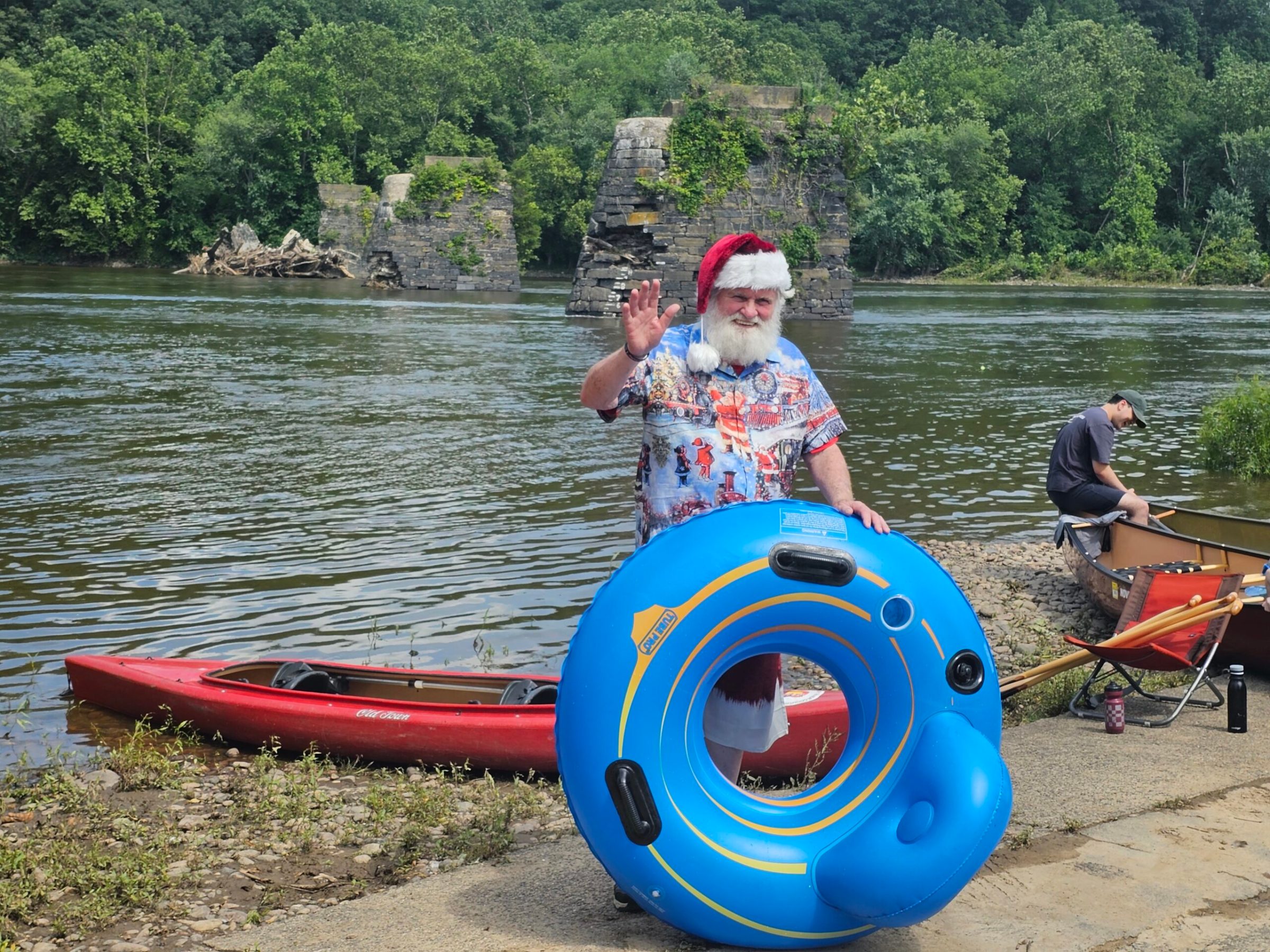 a man riding on the back of a boat in a body of water