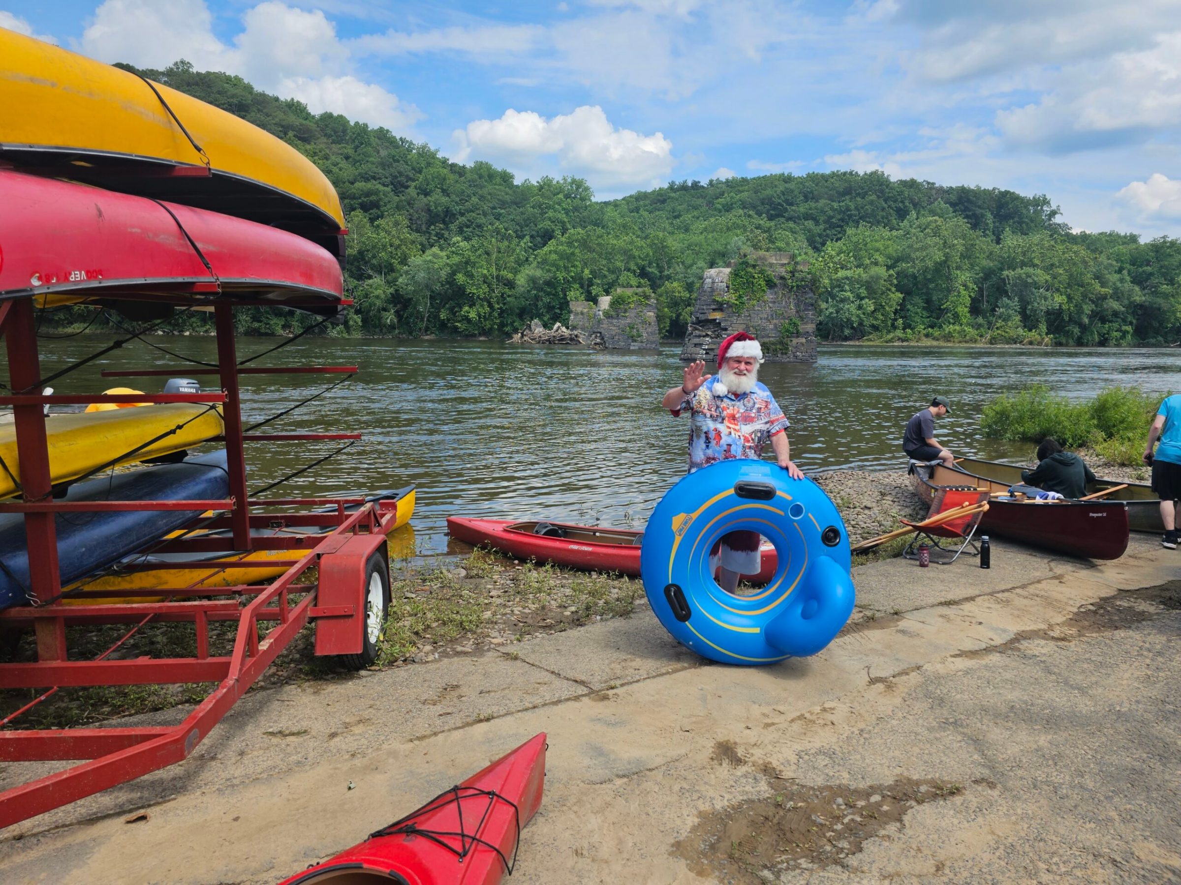 a small boat in a body of water with a colorful umbrella