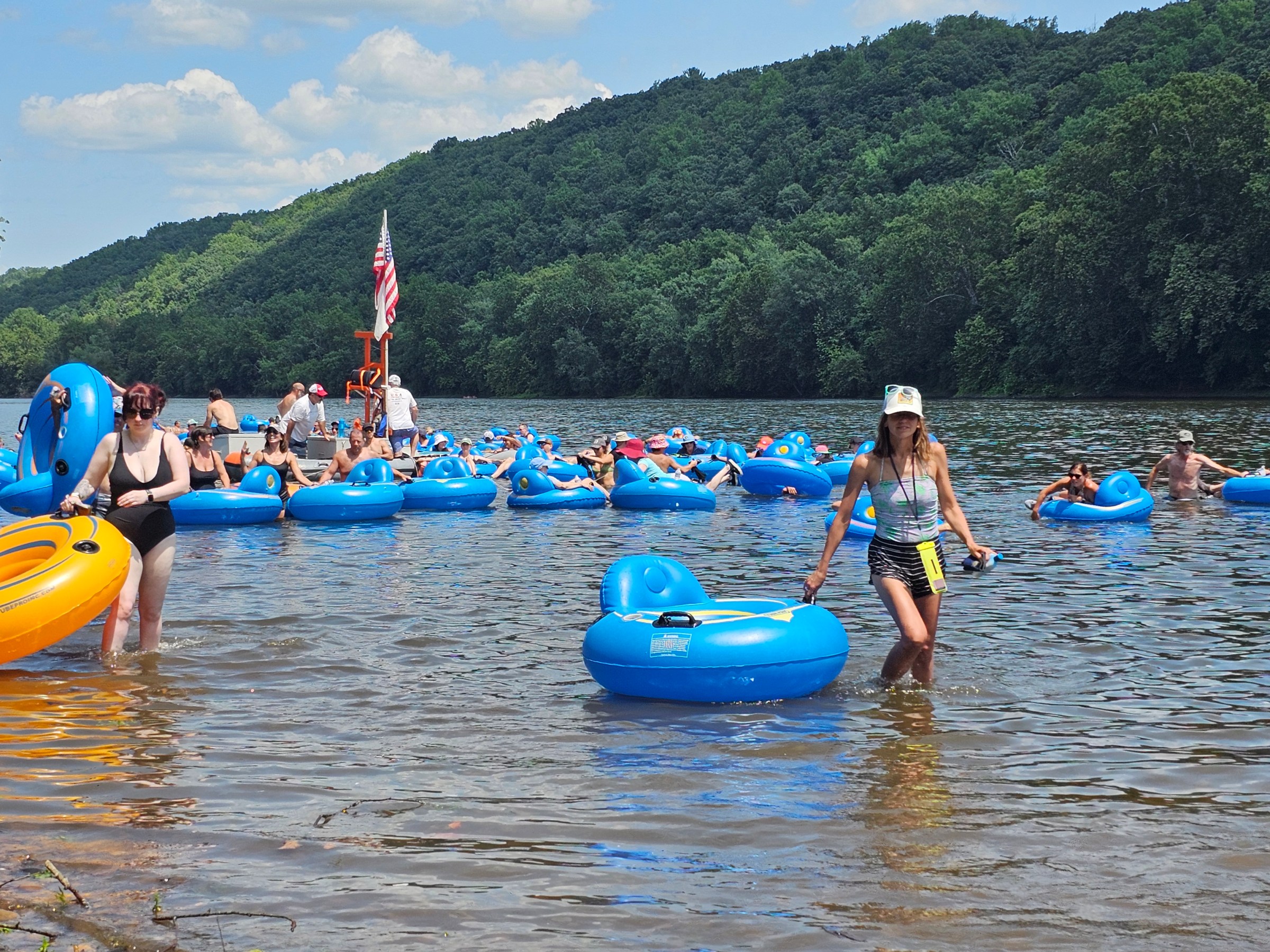 a group of people on a raft in a body of water