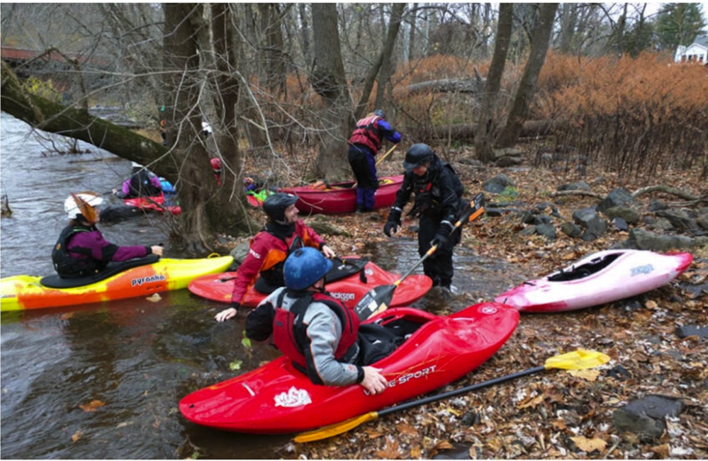 a group of people sitting on a raft